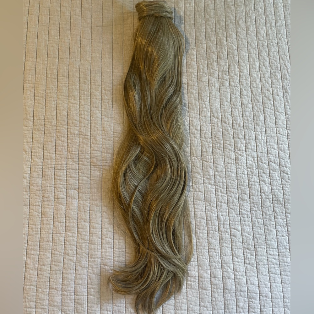 Light brown ponytail extension.